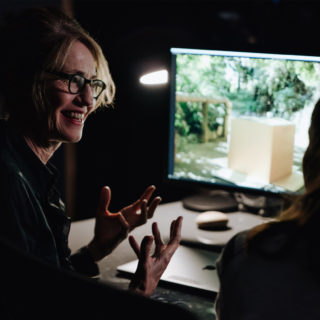 A film maker works on a Mac