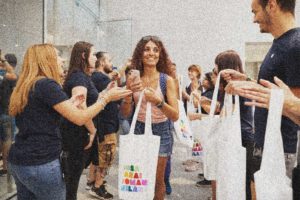 A girl carrying shopping leaves an Apple store in Milan