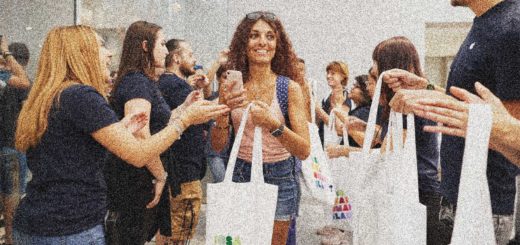 A girl carrying shopping leaves an Apple store in Milan