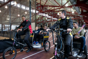 Michael Strahan and Jeff Gordon on rickshaws