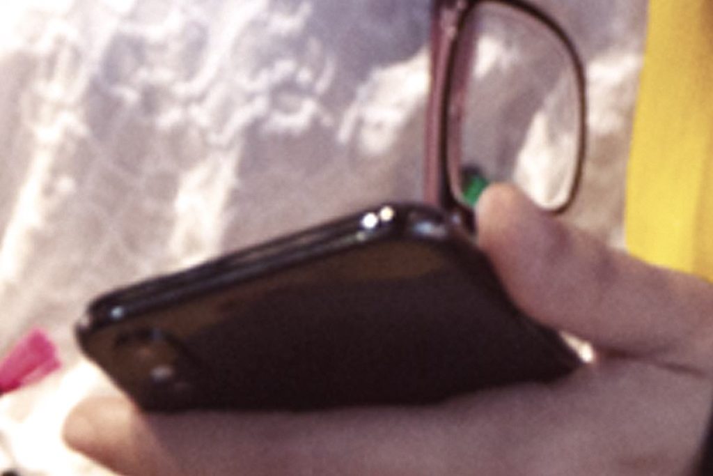 Hand holds iPhone