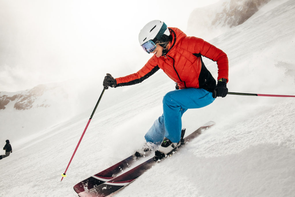 A person skiing wearing an Apple Watch