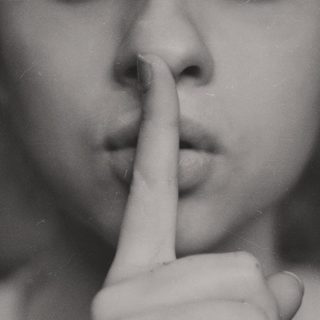 WomanSaysQuiteWithFInger