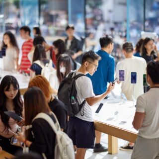 Chinese shoppers look at new ipHone on launch day