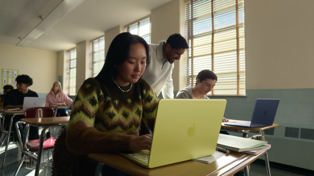 A woman using a MacBook Neo